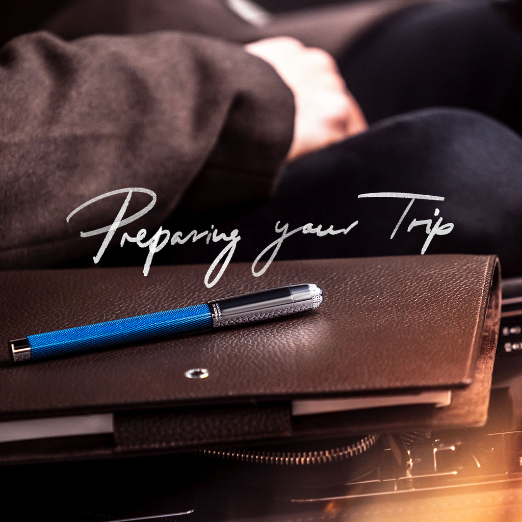Prepping Your Trip | Pen Resting on Planner