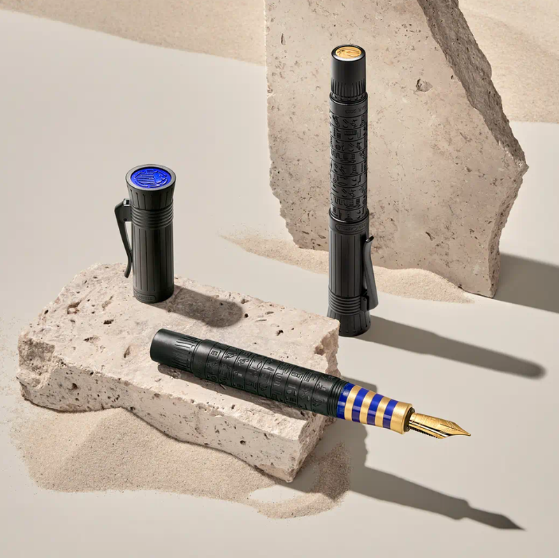 A fountain pen on a rock